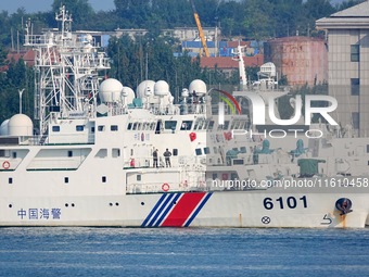 Coast guard ships are seen at a dock in Yantai, China, on September 26, 2024. (