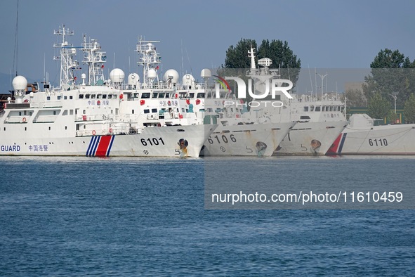 Coast guard ships are seen at a dock in Yantai, China, on September 26, 2024. 