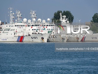 Coast guard ships are seen at a dock in Yantai, China, on September 26, 2024. (