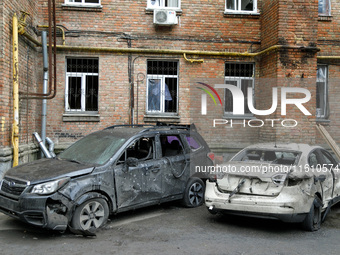 Cars damaged by falling wreckage of a downed Russian 'Shahed' drone in the Pechersk district of Kyiv, Ukraine, on September 26, 2024. NO USE...