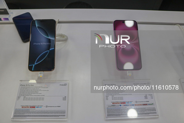 Apple's latest iPhone 16 Pro Max (left) and Apple's latest iPhone 16 Plus (right) series are displayed for sale at Master Arts Shop in Srina...