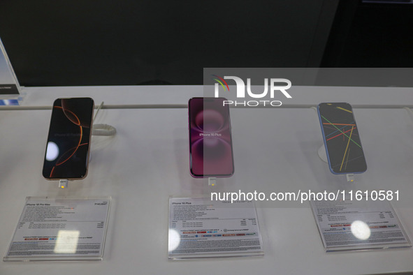 Apple's latest iPhone 16 (right), iPhone 16 Plus (center), and iPhone 16 Pro Max (left) series are displayed for sale at Master Arts Shop in...