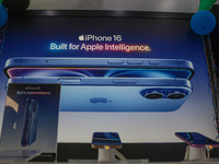 Apple's latest iPhone 16 Pro Max (left) and Apple's latest iPhone 16 Plus (right) series are displayed for sale at Master Arts Shop in Srina...