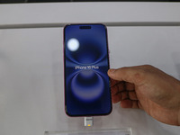 A customer checks Apple's latest iPhone 16 Plus series displayed for sale at Master Arts Shop in Srinagar, Jammu and Kashmir, on September 2...