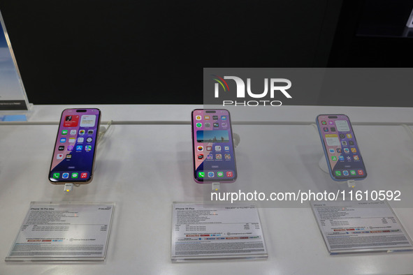 Apple's latest iPhone 16 (right), iPhone 16 Plus (center), and iPhone 16 Pro Max (left) series are displayed for sale at Master Arts Shop in...