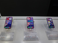 Apple's latest iPhone 16 (right), iPhone 16 Plus (center), and iPhone 16 Pro Max (left) series are displayed for sale at Master Arts Shop in...