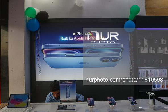 Apple's latest iPhone 16 (right), iPhone 16 Plus (center), and iPhone 16 Pro Max (left) series are displayed for sale at Master Arts Shop in...