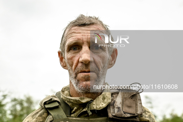 A serviceman of the 65th Separate Mechanized Brigade of the Armed Forces of Ukraine is seen during combat coordination in Ukraine, on Septem...