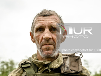 A serviceman of the 65th Separate Mechanized Brigade of the Armed Forces of Ukraine is seen during combat coordination in Ukraine, on Septem...