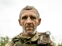 A serviceman of the 65th Separate Mechanized Brigade of the Armed Forces of Ukraine is seen during combat coordination in Ukraine, on Septem...