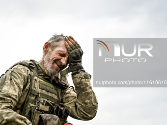 A serviceman of the 65th Separate Mechanized Brigade of the Armed Forces of Ukraine is seen during combat coordination in Ukraine, on Septem...