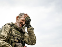 A serviceman of the 65th Separate Mechanized Brigade of the Armed Forces of Ukraine is seen during combat coordination in Ukraine, on Septem...