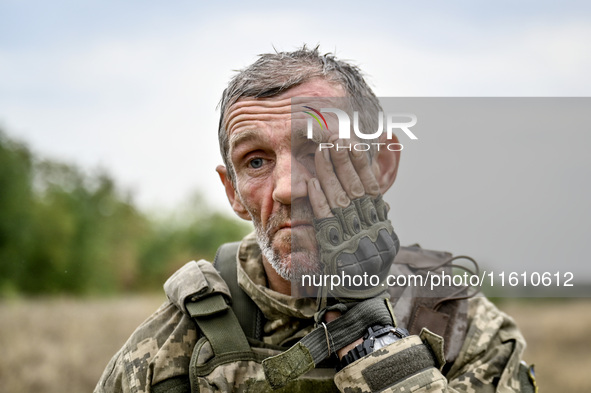 A serviceman of the 65th Separate Mechanized Brigade of the Armed Forces of Ukraine is seen during combat coordination in Ukraine, on Septem...