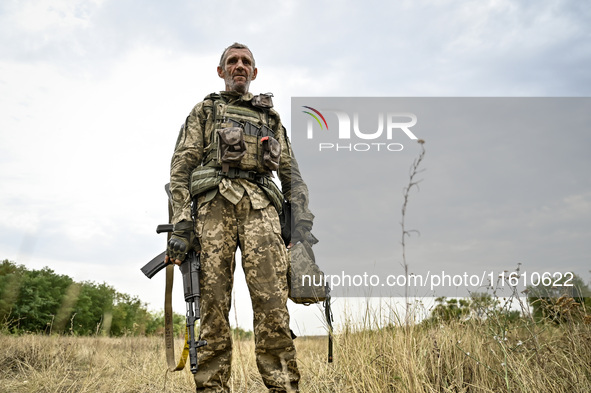 A serviceman of the 65th Separate Mechanized Brigade of the Armed Forces of Ukraine is seen during combat coordination in Ukraine, on Septem...