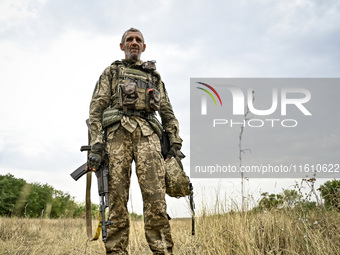 A serviceman of the 65th Separate Mechanized Brigade of the Armed Forces of Ukraine is seen during combat coordination in Ukraine, on Septem...