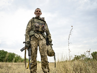 A serviceman of the 65th Separate Mechanized Brigade of the Armed Forces of Ukraine is seen during combat coordination in Ukraine, on Septem...