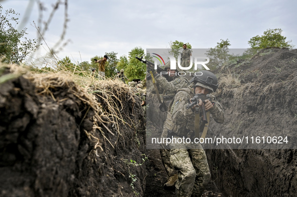 Servicemen of the 65th Separate Mechanized Brigade of the Armed Forces of Ukraine undergo combat cohesion in Ukraine, on September 12, 2024....