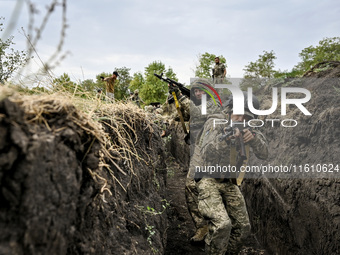 Servicemen of the 65th Separate Mechanized Brigade of the Armed Forces of Ukraine undergo combat cohesion in Ukraine, on September 12, 2024....