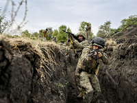 Servicemen of the 65th Separate Mechanized Brigade of the Armed Forces of Ukraine undergo combat cohesion in Ukraine, on September 12, 2024....