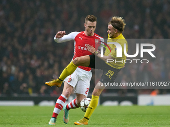 Calum Chambers of Arsenal is confronted by Marcel Schmelzer of Borussia Dortmund during the UEFA Champions League Group D soccer match betwe...