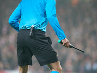 An assistant referee holds the Electronic Beeper Soccer Referee Flag during the UEFA Champions League Group D soccer match between Arsenal a...