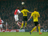 Yaya Sanogo of Arsenal competes for the ball with Neven Subotic of Borussia Dortmund during the UEFA Champions League Group D soccer match b...