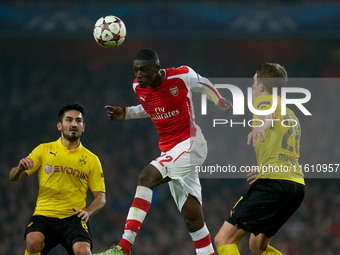 Yaya Sanogo (C) of Arsenal is in action during the UEFA Champions League Group D soccer match between Arsenal and Borussia Dortmund at the E...