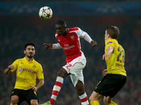 Yaya Sanogo (C) of Arsenal is in action during the UEFA Champions League Group D soccer match between Arsenal and Borussia Dortmund at the E...