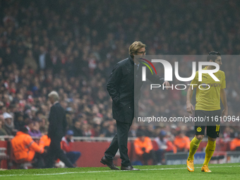 Jurgen Klopp, head coach of Borussia Dortmund, gestures during the UEFA Champions League Group D soccer match between Arsenal and Borussia D...