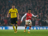 Alexis Sanchez of Arsenal is in action during the UEFA Champions League Group D soccer match between Arsenal and Borussia Dortmund at the Em...