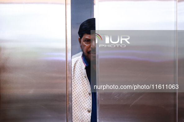 Republican Party of India (A) political party president Ramdas Bandu Athawale uses a lift inside a hotel after his election campaign in Srin...