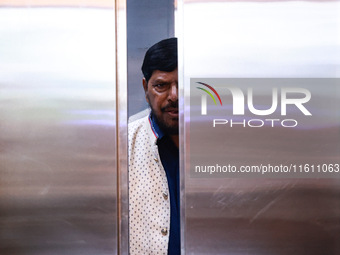 Republican Party of India (A) political party president Ramdas Bandu Athawale uses a lift inside a hotel after his election campaign in Srin...