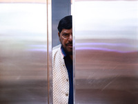 Republican Party of India (A) political party president Ramdas Bandu Athawale uses a lift inside a hotel after his election campaign in Srin...