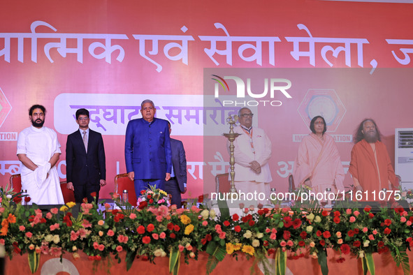 Vice President Jagdeep Dhankhar, Spiritual Head of Parmarth Niketan Ashram Chidanand Saraswati, and religious leader Sadhvi Ritambhara, alon...