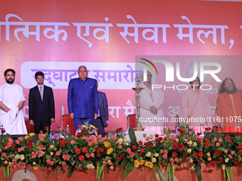 Vice President Jagdeep Dhankhar, Spiritual Head of Parmarth Niketan Ashram Chidanand Saraswati, and religious leader Sadhvi Ritambhara, alon...