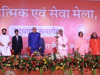 Vice President Jagdeep Dhankhar, Spiritual Head of Parmarth Niketan Ashram Chidanand Saraswati, and religious leader Sadhvi Ritambhara, alon...