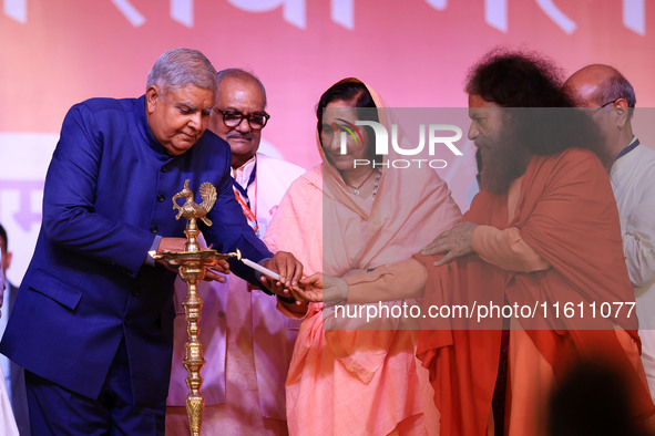 Vice President Jagdeep Dhankhar, Spiritual Head of Parmarth Niketan Ashram Chidanand Saraswati, and religious leader Sadhvi Ritambhara light...