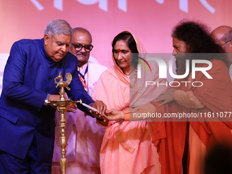 Vice President Jagdeep Dhankhar, Spiritual Head of Parmarth Niketan Ashram Chidanand Saraswati, and religious leader Sadhvi Ritambhara light...