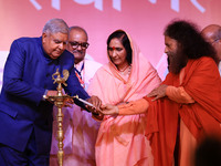 Vice President Jagdeep Dhankhar, Spiritual Head of Parmarth Niketan Ashram Chidanand Saraswati, and religious leader Sadhvi Ritambhara light...