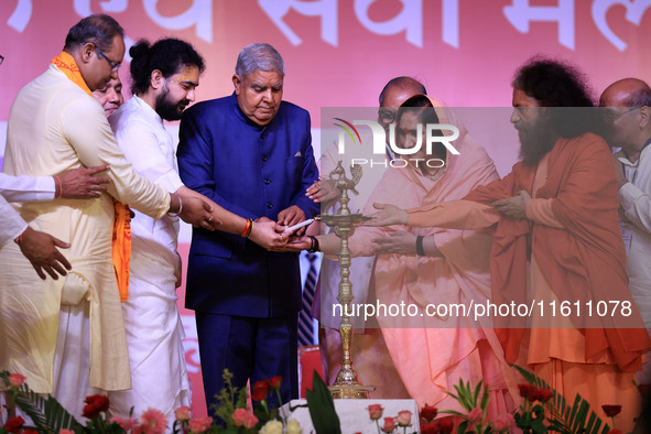 Vice President Jagdeep Dhankhar, Spiritual Head of Parmarth Niketan Ashram Chidanand Saraswati, and religious leader Sadhvi Ritambhara light...