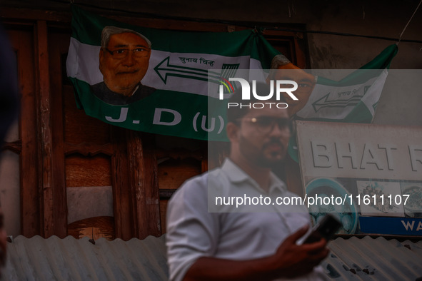 Nitish Kumar's Janata Dal (United) Indian political party flags are installed during assembly elections in Kreeri-Wagoora constituency in Ba...