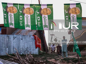 Nitish Kumar's Janata Dal (United) Indian political party flags are installed during assembly elections in Kreeri-Wagoora constituency in Ba...