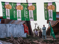 Nitish Kumar's Janata Dal (United) Indian political party flags are installed during assembly elections in Kreeri-Wagoora constituency in Ba...