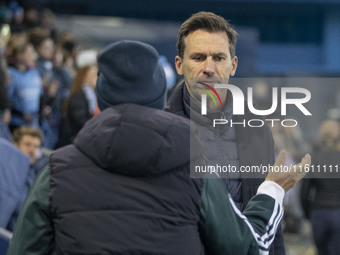 Manchester City W.F.C. manager Gareth Taylor shakes hands with Paris FC manager Sandrine Soubeyrand during the UEFA Women's Champions League...