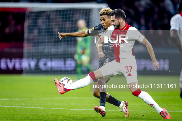 Besiktas JK midfielder Gedson Fernandes and AFC Ajax Amsterdam defender Josip Sutalo during the match between Ajax and Besiktas at the Johan...