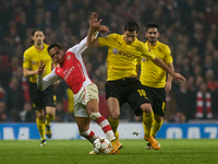 Alexis Sanchez of Arsenal vies for the ball with Henrikh Mkhitaryan of Borussia Dortmund during the UEFA Champions League Group D soccer mat...