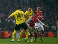 Alexis Sanchez (R) of Arsenal competes for the ball with Milos Jojic (L) of Borussia Dortmund during the UEFA Champions League Group D socce...