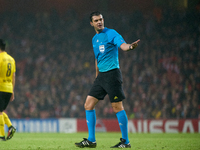 UEFA appoints match referee Viktor Kassai, who gestures during the UEFA Champions League Group D soccer match between Arsenal and Borussia D...