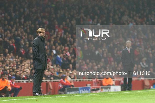 Jurgen Klopp (L), head coach of Borussia Dortmund, and Arsene Wenger (R), head coach of Arsenal, during the UEFA Champions League Group D so...