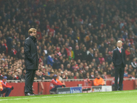 Jurgen Klopp (L), head coach of Borussia Dortmund, and Arsene Wenger (R), head coach of Arsenal, during the UEFA Champions League Group D so...